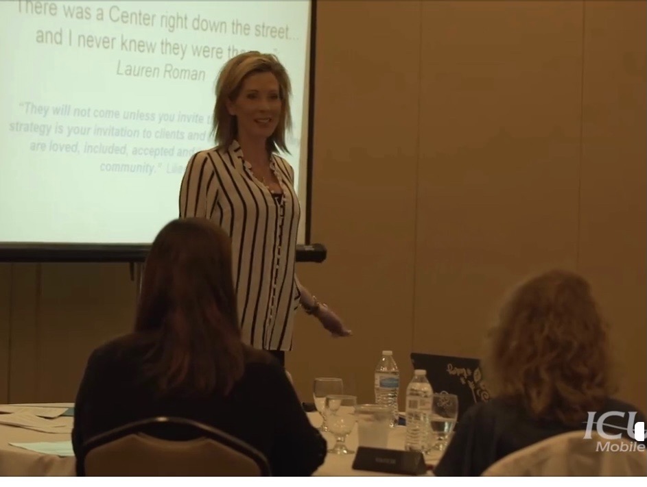 Liliana Grace speaking at a client event